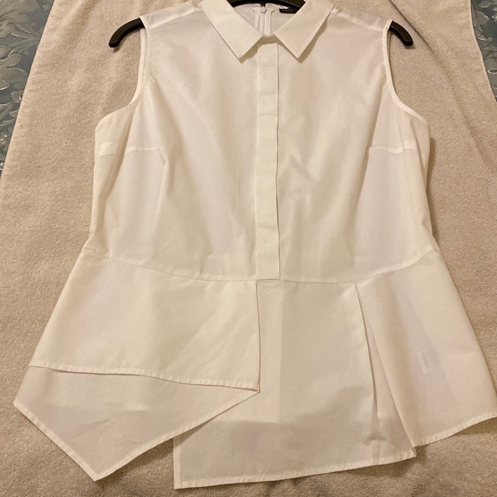 White sleeveless back-zip Antonio Melani dress shirt.